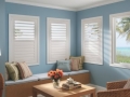 Shutters in lite blue room